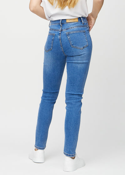 Denim slim ultra high rise jeans set bagfra, så man kan se hele produktet.