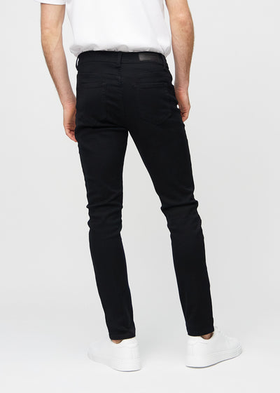 Sorte slim jeans set bagfra, så man kan se hele produktet.